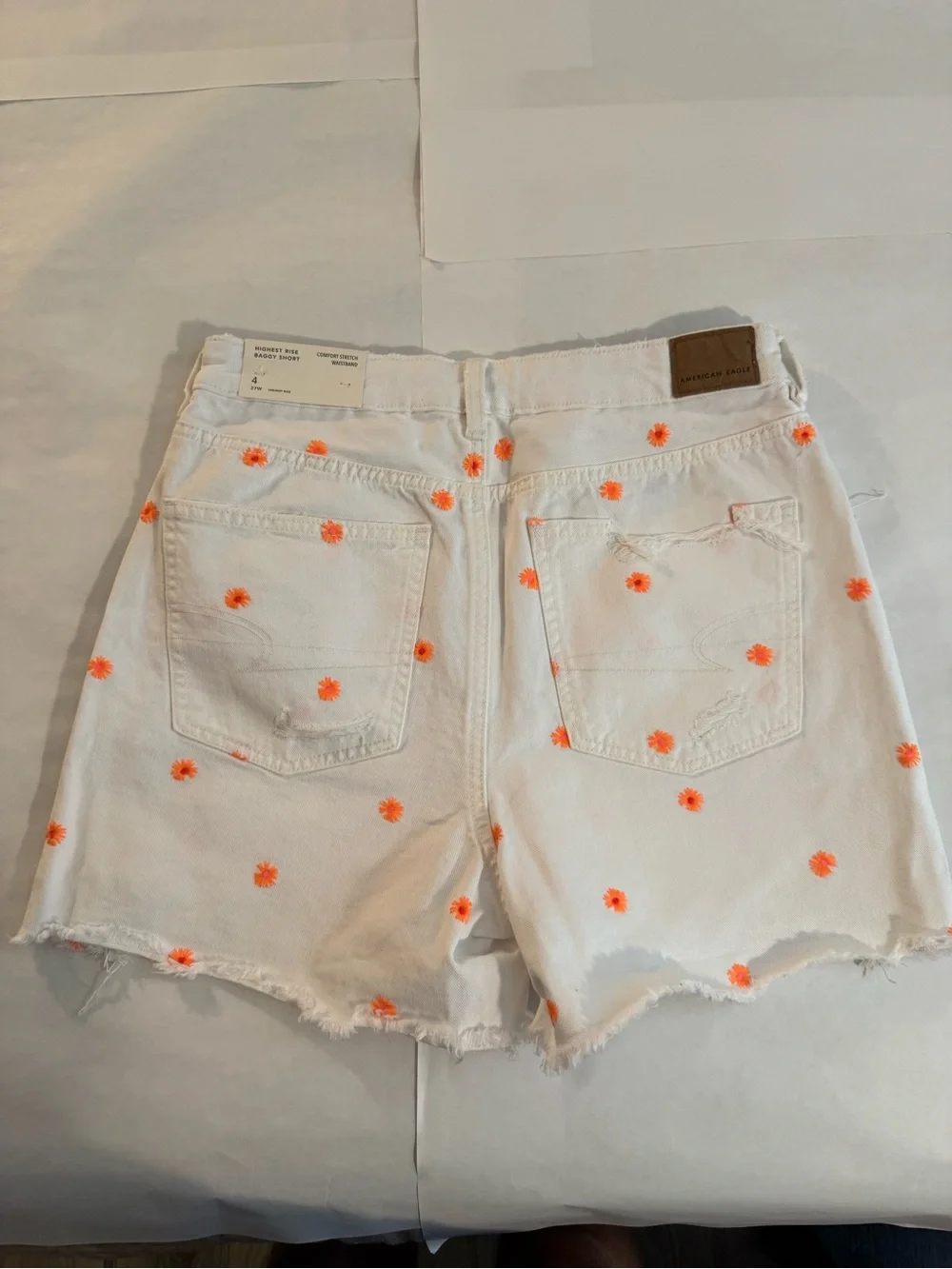 American Eagle Outfitters White Denim Shorts with Orange Daisy Embroidery